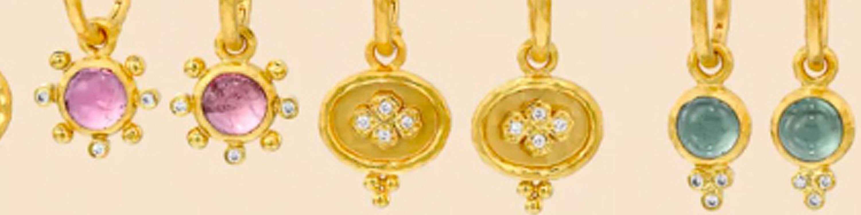 row of gold drop earrings