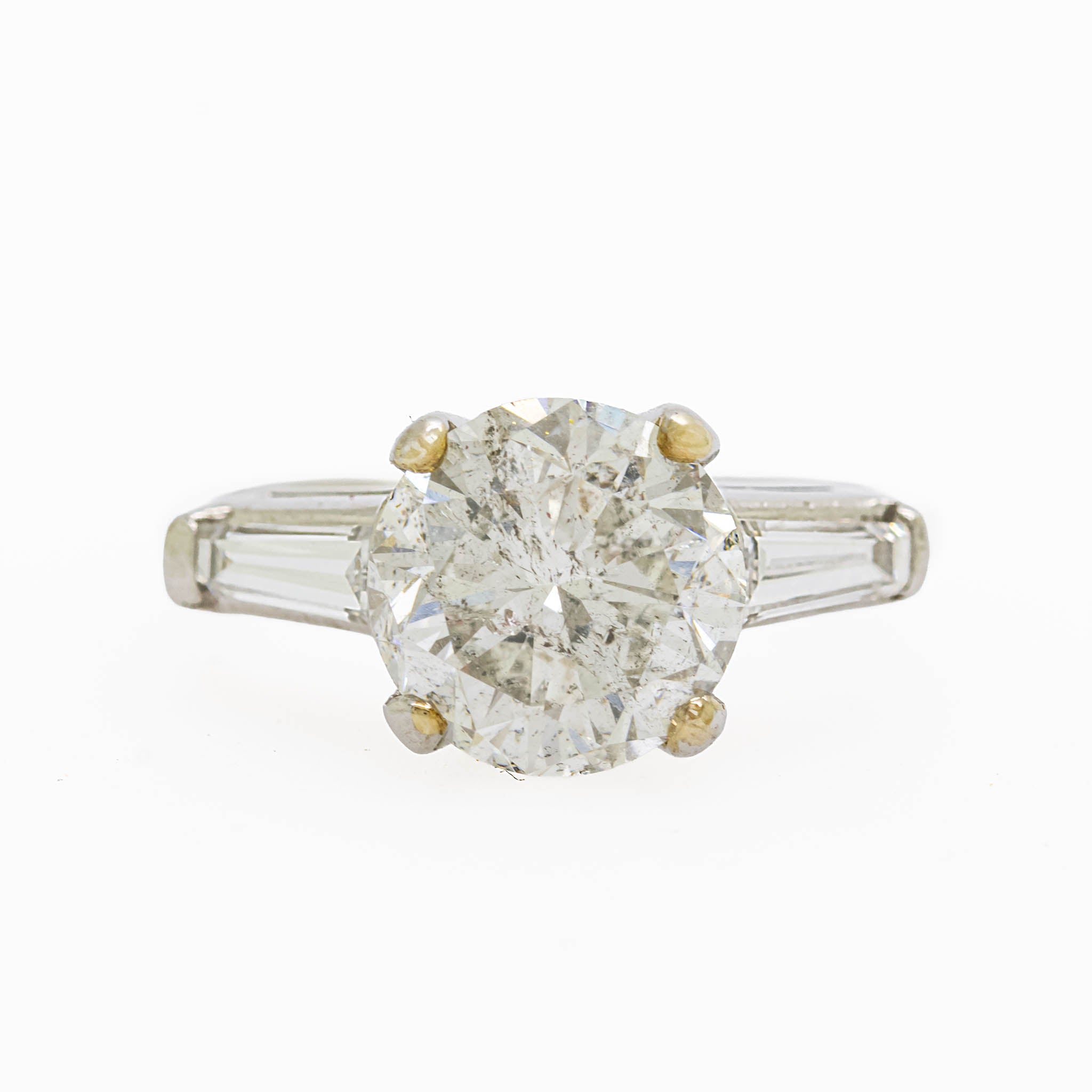 Round Diamond Engagement Ring With Tapered Baguette Diamonds