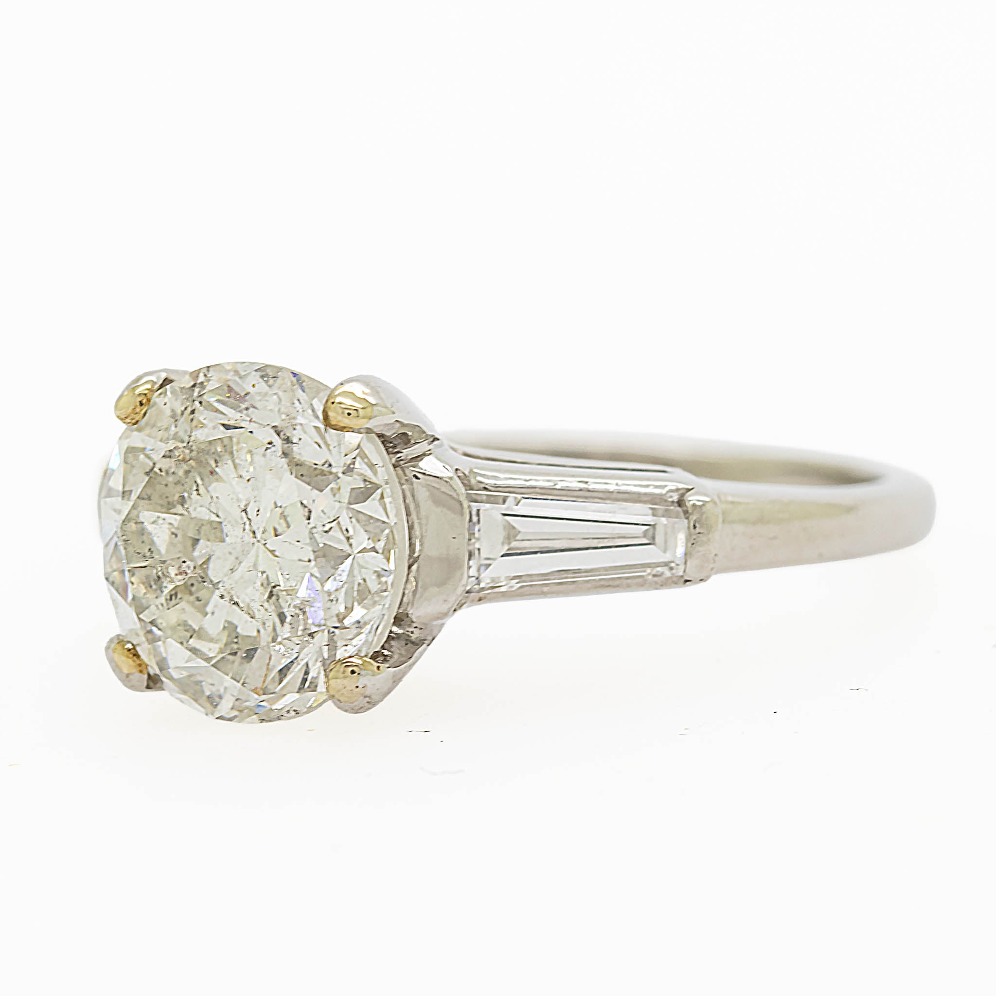 Round Diamond Engagement Ring With Tapered Baguette Diamonds