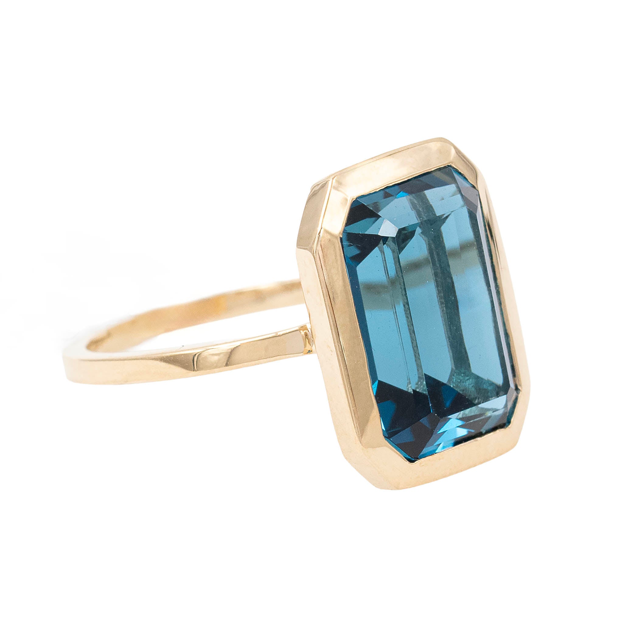 Large Bezel Set Emerald Cut Blue Topaz Cocktail Ring
