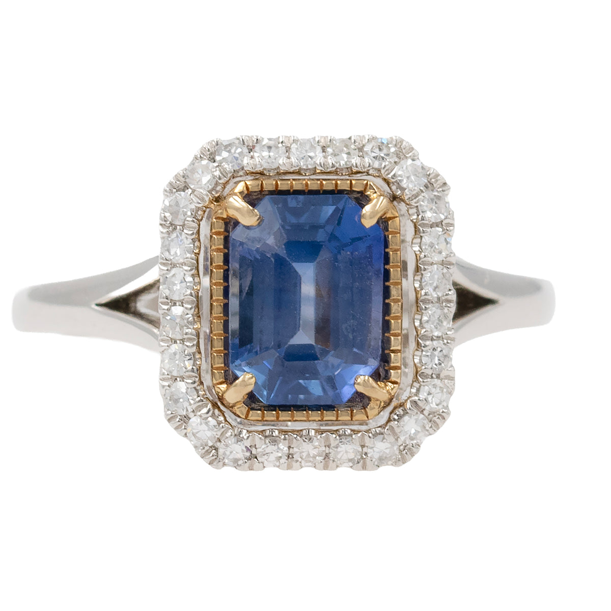 Emerald Cut Sapphire Ring With Diamond Halo In Two Tone Mounting