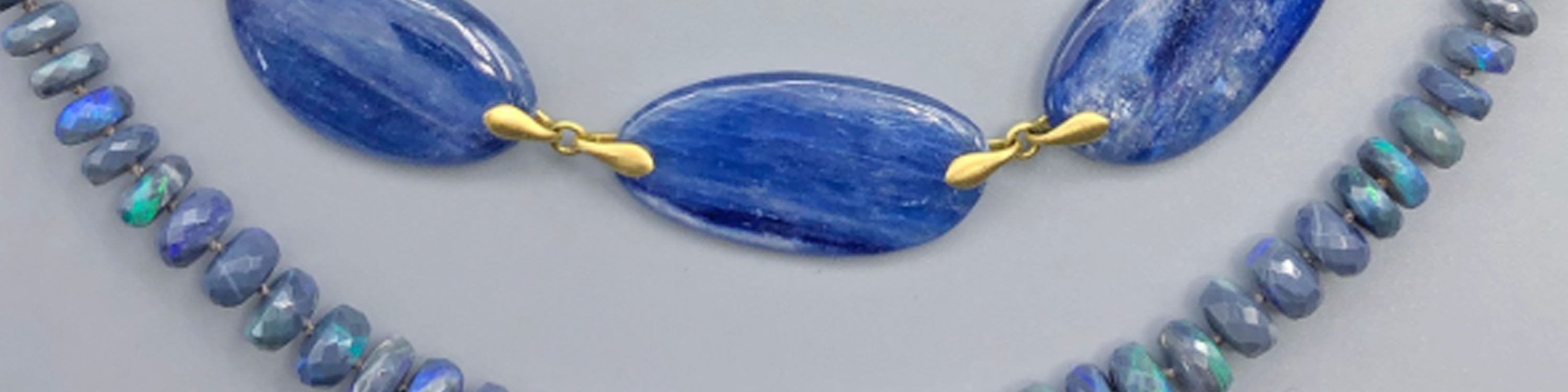 Kyanite and opal necklaces in gold
