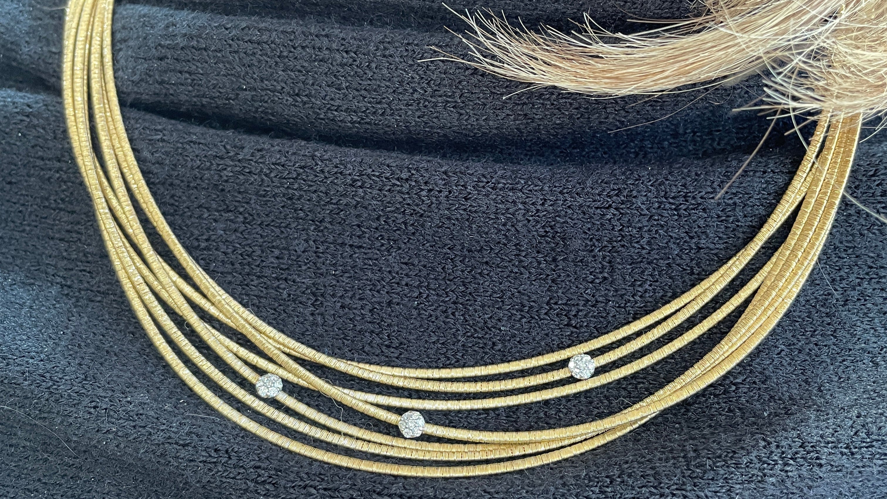 multirow gold necklace with diamonds