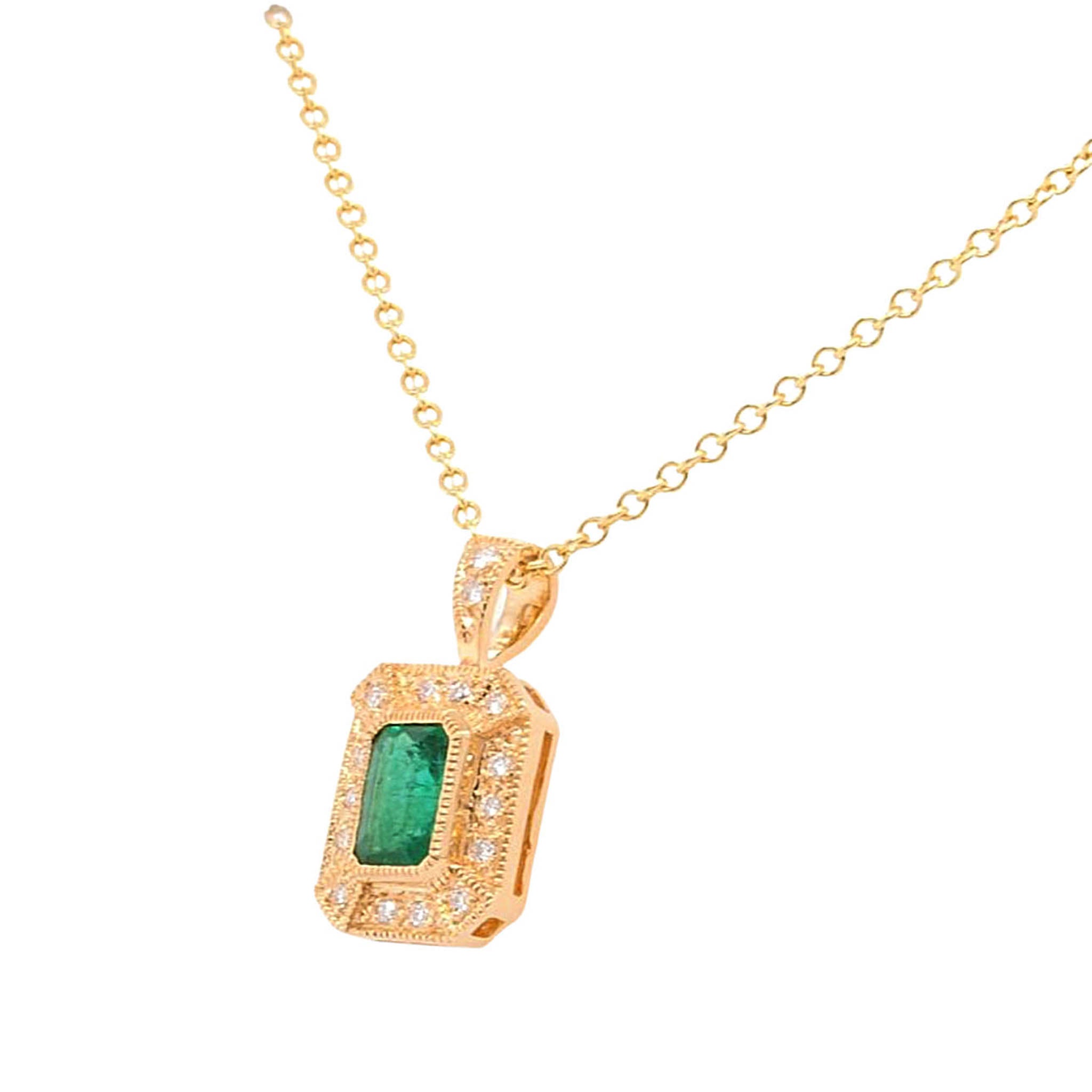 Emerald Cut Emerald With Diamond Halo Pendant In Yellow Gold