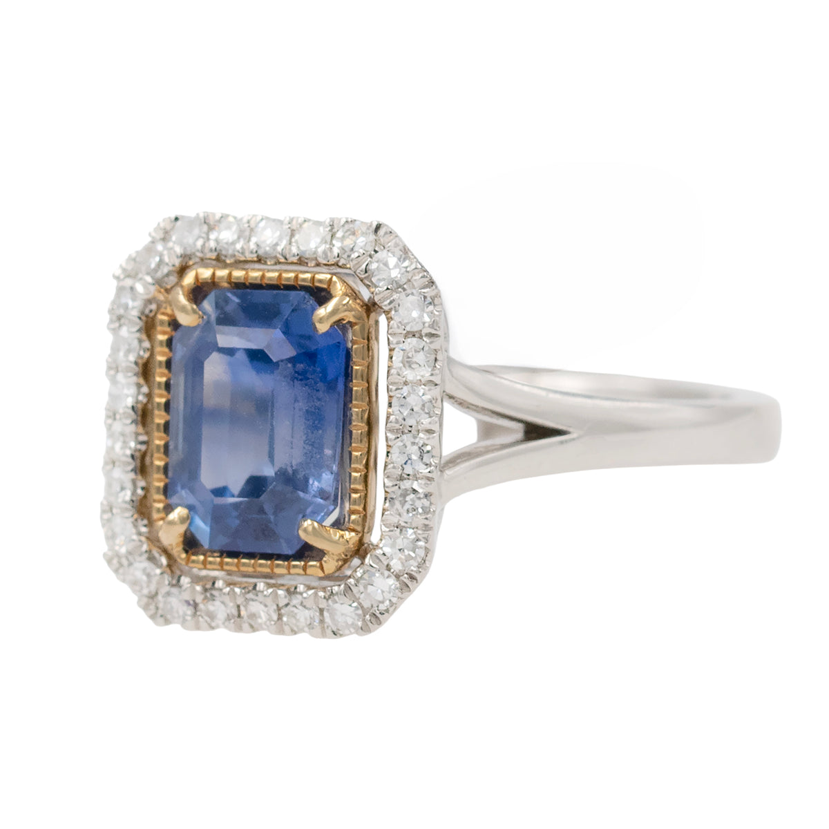 Emerald Cut Sapphire Ring With Diamond Halo In Two Tone Mounting
