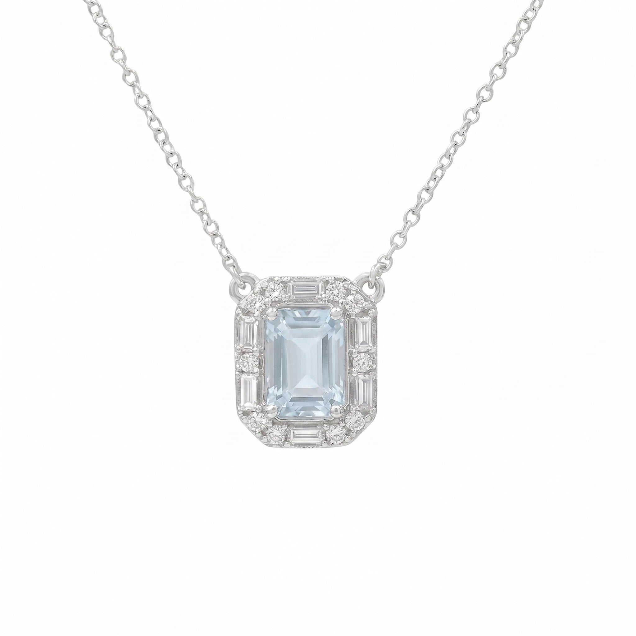 Emerald Cut Aquamarine With Round And Baguette Diamond Halo